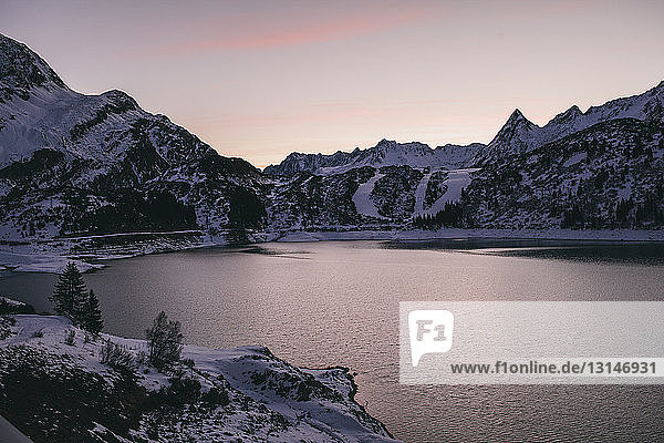 Kops reservoir and snow covered mountain range  evening  Galtur  Austria