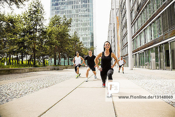 Personal trainers doing outdoor training in urban place  Munich  Bavaria  Germany