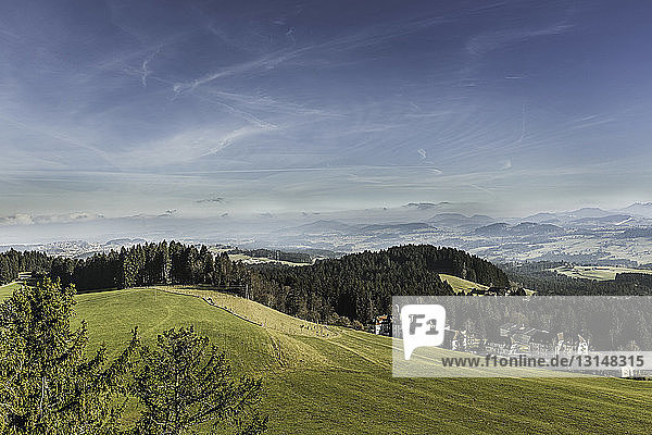 Landscape of hills with distant mountains  Allgau  Germany