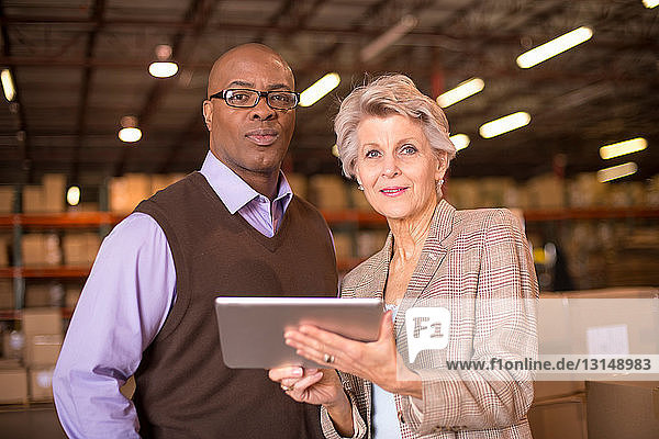 Warehouse managers using digital tablet