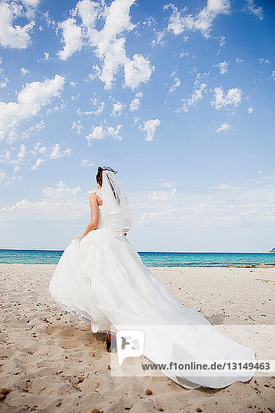 bride walking on beach