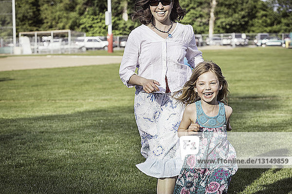 Mother and daughter running together