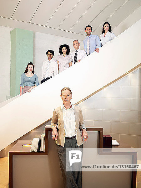 Portrait of office workers on stairs