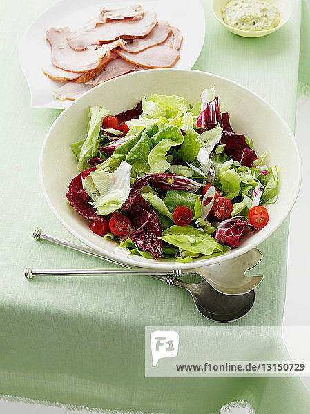 Salad bowl with slices of ham