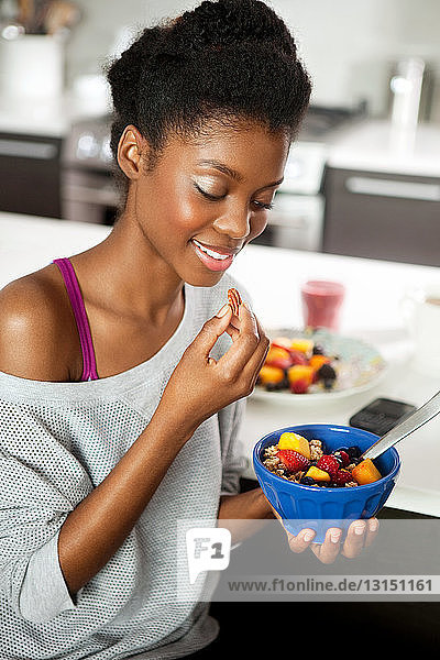 Young woman eating a healthy breakfast