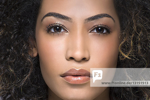 Close up studio portrait of beautiful young woman