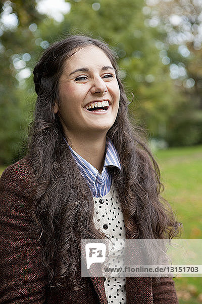 Smiling girl standing in park