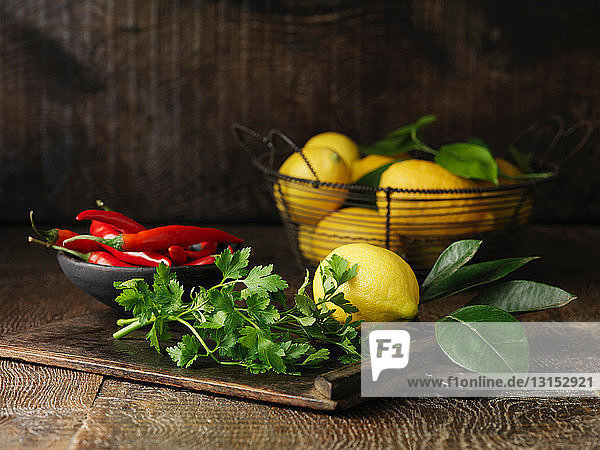 Still life with red chillies and lemons