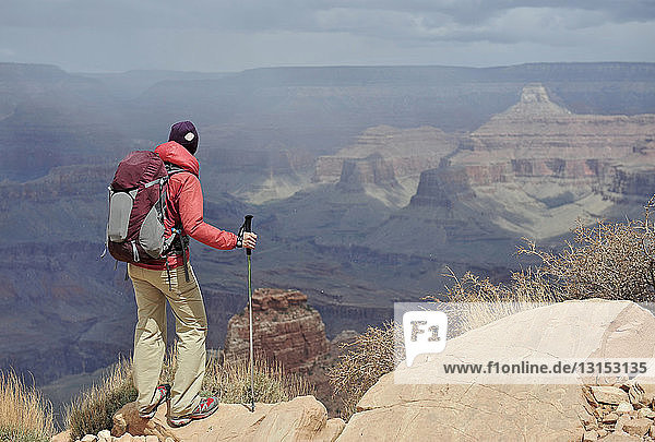 Female hiker viewing Grand Canyon  Flagstaff  Arizona  USA