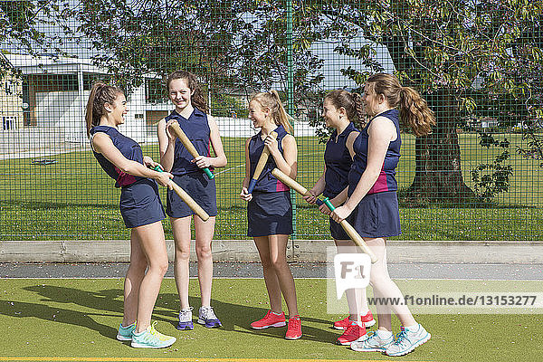 Group of girls with rounders bats