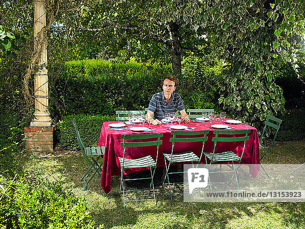 Man at table waiting for his friends