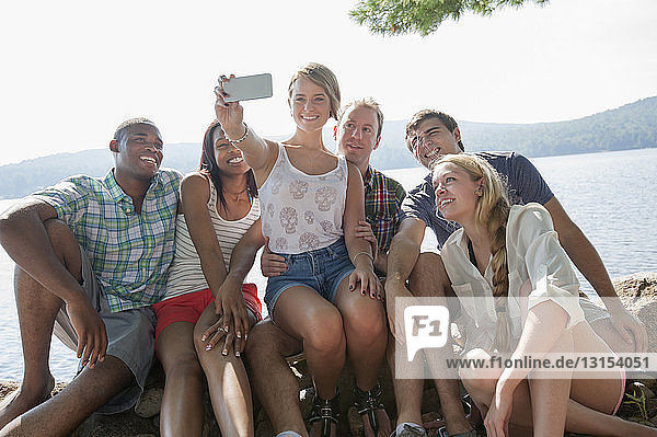 Group of friends photographing themselves