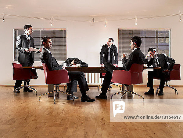 Businessmen at boardroom table
