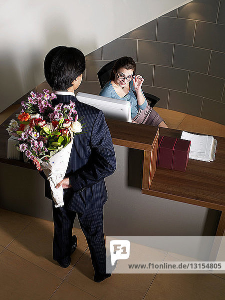 Office receptionist with male worker