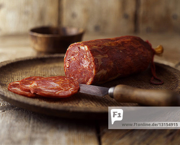 Still life of fresh chorizo cured smoked sliced sausage