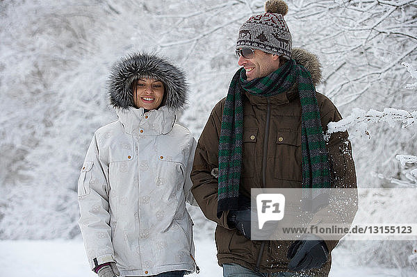 Couple walking in the snow.