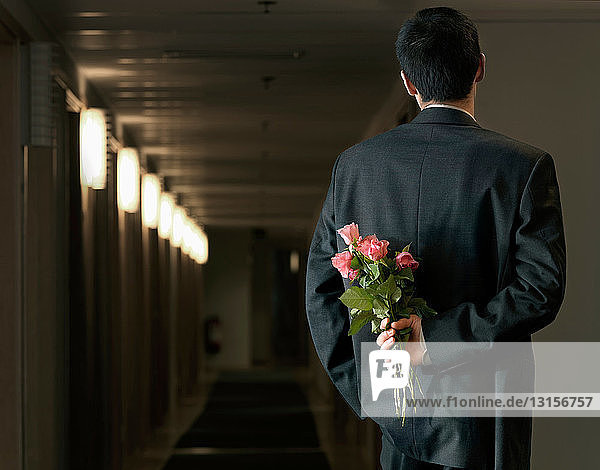 Man in office with flowers