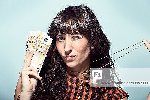 Woman holding Euro bills