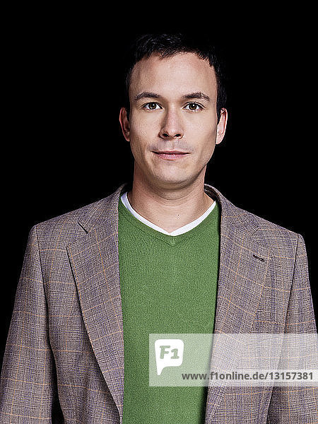 Man wearing green sweater and jacket  portrait