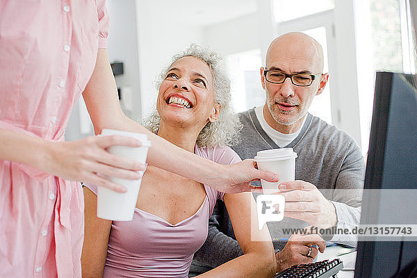 2 business people receiving coffee