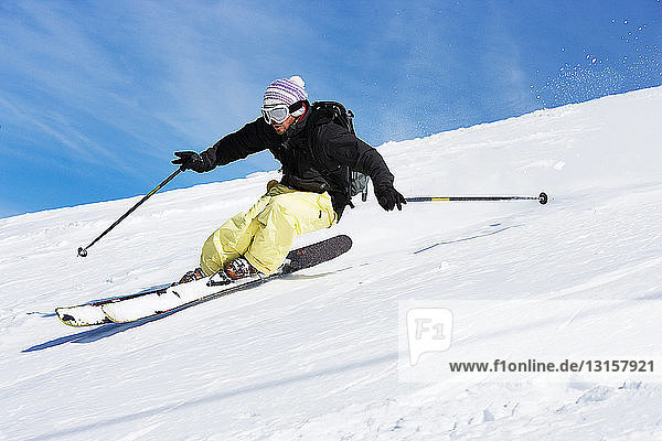 Male skiing down mountain