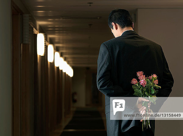 Man in office with flowers