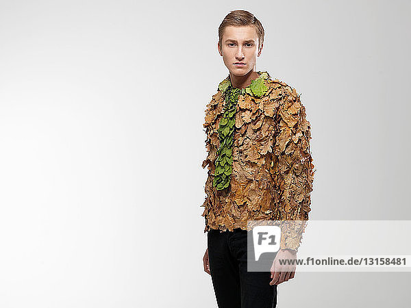 Man wearing shirt and tie made from leaves