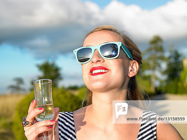 Woman drinking champagne  laughing