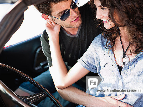 couple embracing in car