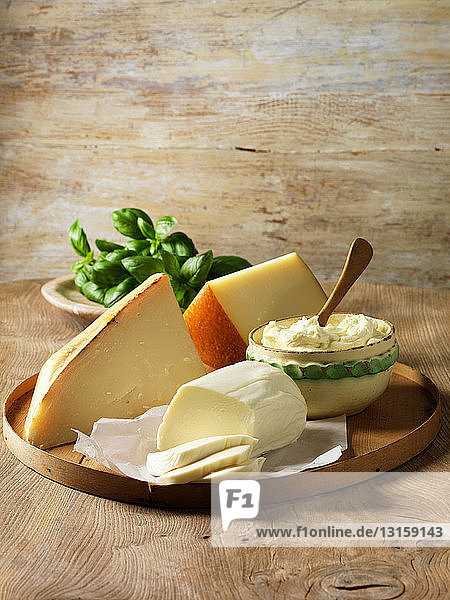 Italian cheeses on wooden board