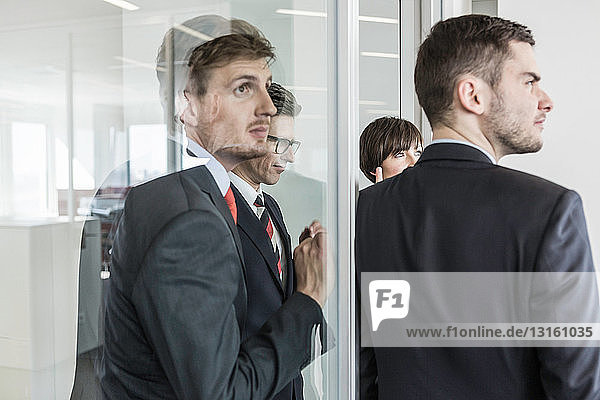 Businesspeople standing in doorway