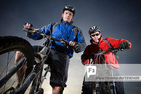 Portrait of two mountain bikers.