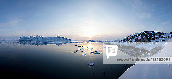 Still water in snowy landscape