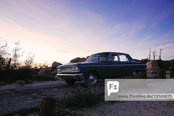 Vintage car on roadside in desert at dusk  Los Angeles  California  USA