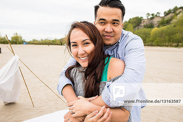 Young couple hugging at beach