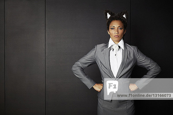 Businesswoman wearing fancy dress ears