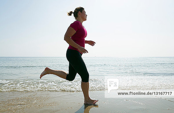 Woman running on beach