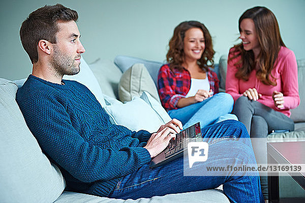Friends sitting in living room together