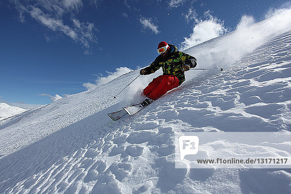 Mid adult man skiing down steep slope  Mayrhofen  Tyrol  Austria