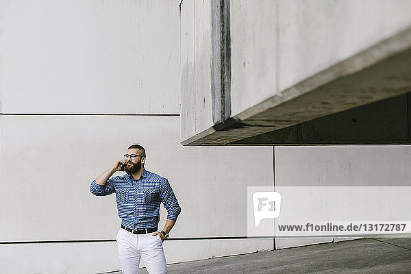 Bearded hipster businessman on the phone