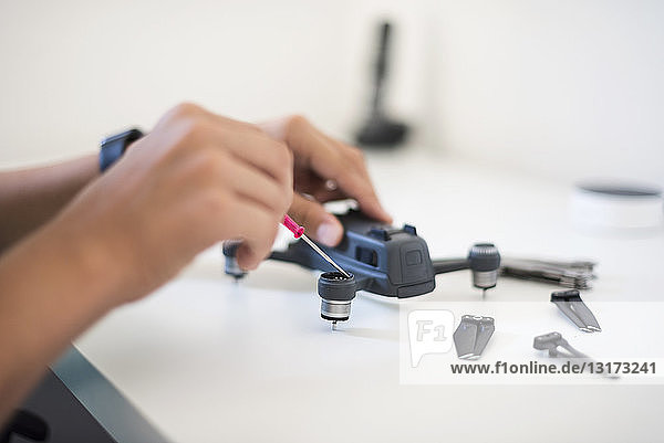 Boy repairing drone