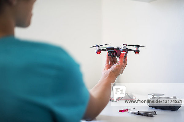 Boy repairing drone