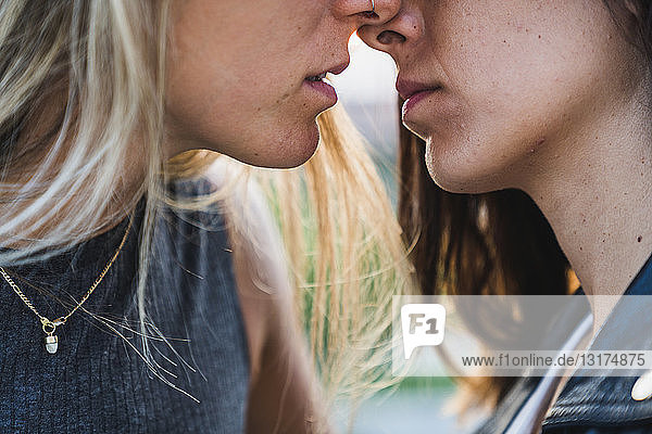 Close-up of affectionate lesbian couple about to kiss