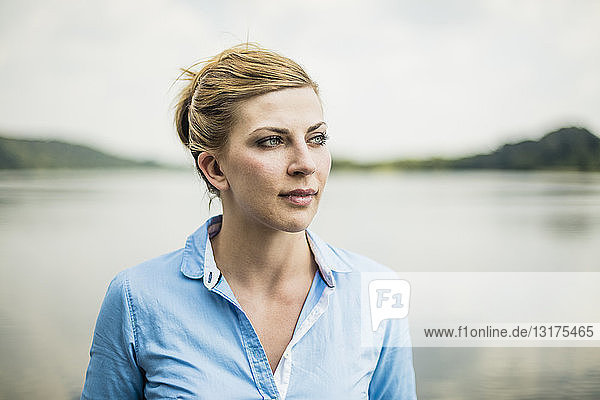Portrait of woman at a lake looking sideways