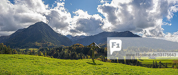 Germany Bavaria Allgaeu Allgaeu Alps Oberstdorf Cross in the Oy Valley Stillach Valley in the background