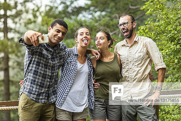Italy  Massa  friends taking a funny selfie together outdoors