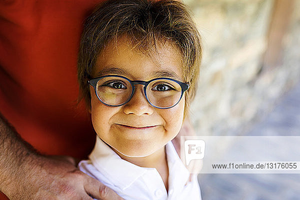 Portrait of smiling little boy wearing glasses