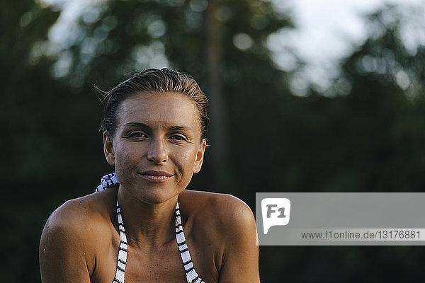 Portrait of smiling woman wearing a bikini