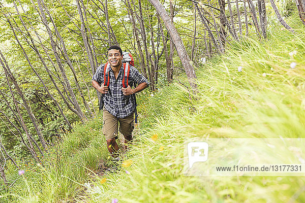 Italy  Massa  smiling young man hiking in the Alpi Apuane mountains