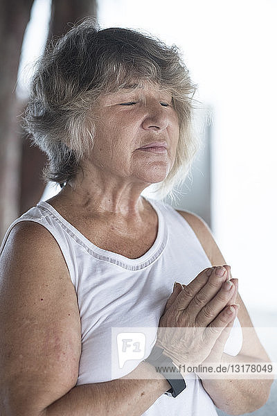 Senior woman doing a yoga exercise